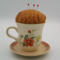 This is the backside of the teacup pincushion and shows the different flowers as well as the details of the fabric used.